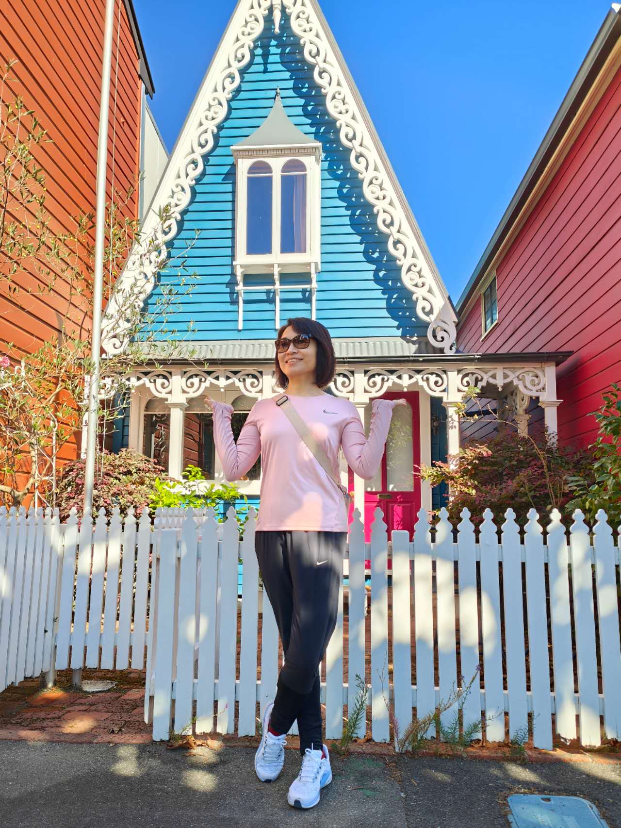 Katherine beside a South Street cottage